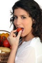 Woman eating cherry-tomato Royalty Free Stock Photo