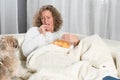 Woman eating chips and looking at dog Royalty Free Stock Photo