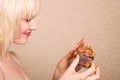 Woman eating chocolate cupcake Royalty Free Stock Photo