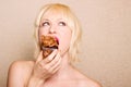Woman eating chocolate cupcake