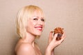 Woman eating chocolate cupcake Royalty Free Stock Photo