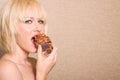 Woman Eating Chocolate Cupcake