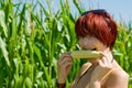 Woman eating a Corncob