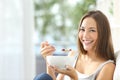 Woman eating cornflakes at home Royalty Free Stock Photo