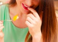 Woman eating cream cake with fruits. Gluttony. Royalty Free Stock Photo