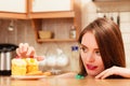 Woman eating delicious sweet cake. Gluttony. Royalty Free Stock Photo