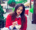 Woman eating desert in a french restaurant. Royalty Free Stock Photo