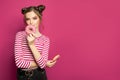 Woman eating donuts on colorful pink background Royalty Free Stock Photo