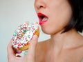 Woman eating doughnut Royalty Free Stock Photo