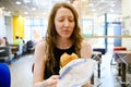 Woman eating in fast food restaurant Royalty Free Stock Photo
