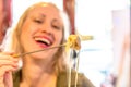 Woman eating fondue cheese Royalty Free Stock Photo