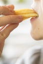 woman eating french fries. The concept of harmful food that causes cancer Royalty Free Stock Photo