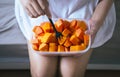 Woman eating fresh fruit papaya slices,Concept healthy food Royalty Free Stock Photo