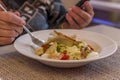 Woman eating a fresh salad at restaurant Royalty Free Stock Photo