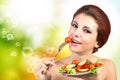 Woman eating fresh vegetables salad Royalty Free Stock Photo