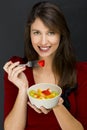 Woman eating a fruit salad Royalty Free Stock Photo