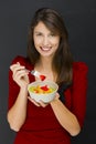 Woman eating a fruit salad Royalty Free Stock Photo