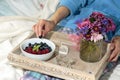 Woman eating fruits in bed