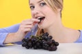 Woman eating grapes Royalty Free Stock Photo