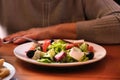 Woman eating greek salad in cafe Royalty Free Stock Photo