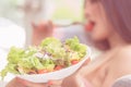 Woman eating green healthy Vegetable salad and relaxing at home for woman beauty and healthy lifestyle eating. Woma realxing