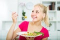 Woman eating green salad Royalty Free Stock Photo