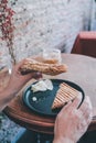 Woman eating grill sandwich ham cheese and salad  lettuce, ham, cheese, tomato and potato chipwith a cup of coffee for Breakfast Royalty Free Stock Photo