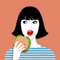 Woman eating hamburger