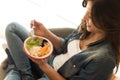 Woman eating a healthy bowl