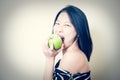 Woman eating healthy green apple portrait Royalty Free Stock Photo