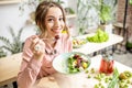 Woman eating healthy green food