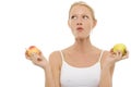 Woman eating and holding apples in the hands