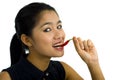 Woman eating a hot chili pepper Royalty Free Stock Photo