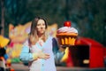 Woman Eating a Huge Cupcake Feeling Sick