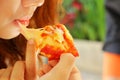 Woman eating Italian pizza ham cheese Royalty Free Stock Photo