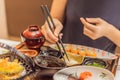 Woman eating japanese food in a japanese food restaurant Royalty Free Stock Photo