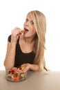 Woman eating jelly beans one look
