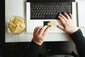 Woman eating junk food, snacking with chips