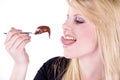 Woman eating a liquid chocolate Royalty Free Stock Photo