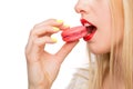 Woman eating macaroon sweets Royalty Free Stock Photo