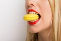 Woman eating macaroon Royalty Free Stock Photo