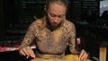 Woman eating national Buryat Mongolian dish cheburek. Big large xxxl 68 cm heburek fry with cheese meat onions into