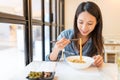 Woman eating noodles in chinese restaurant Royalty Free Stock Photo
