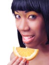 Woman eating an orange