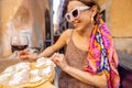 Woman eating pizza at italian restaurant outdoors Royalty Free Stock Photo