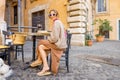 Woman eating pizza at italian restaurant outdoors Royalty Free Stock Photo