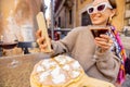 Woman eating pizza at italian restaurant outdoors Royalty Free Stock Photo
