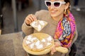 Woman eating pizza at italian restaurant outdoors Royalty Free Stock Photo