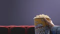 Woman eating popcorn at the movie theater Royalty Free Stock Photo