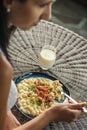 Woman eating potato dumplings with sheep cheese and bacon, traditional slovakian food, slovak gastronomy Royalty Free Stock Photo